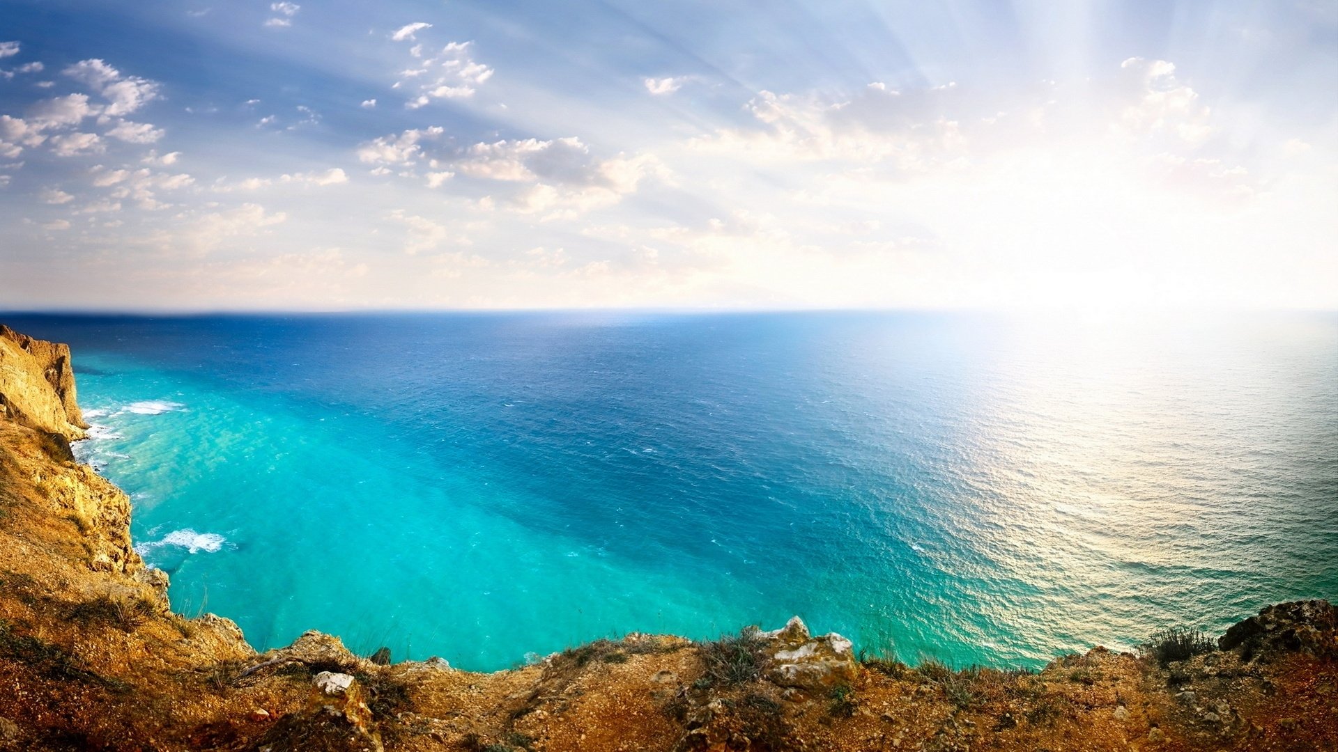 landscape sea ocean rock sun sky clouds nature