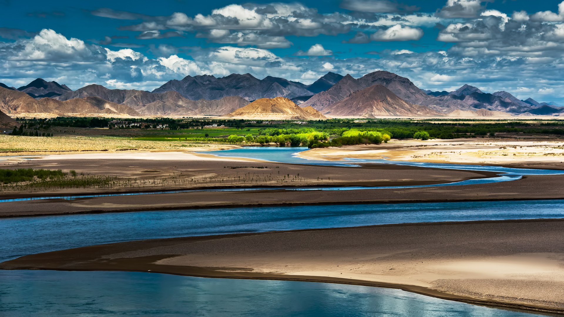 china tíbet oasis río montañas cielo nubes sombras luz