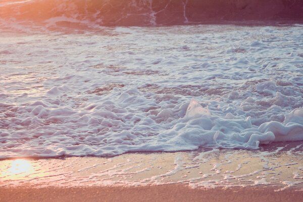 Sea foam, waves close-up