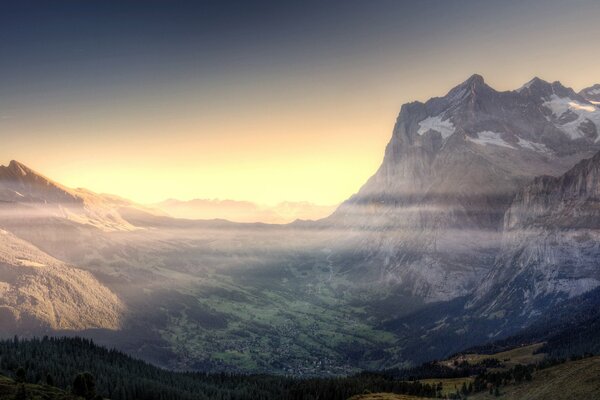 Mountain valley in the morning fog