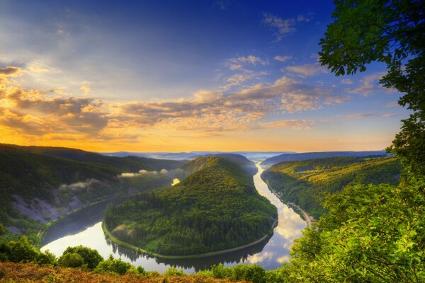 The river is like a snake against a cloudy sky