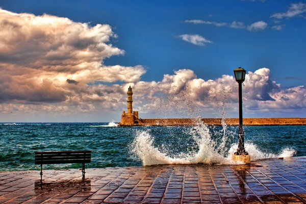 Sea surf and splashing waves on the pier