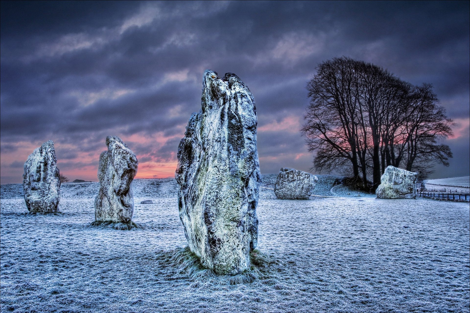 wiltshire united kingdom the field stones megalith sky clouds winter snow night