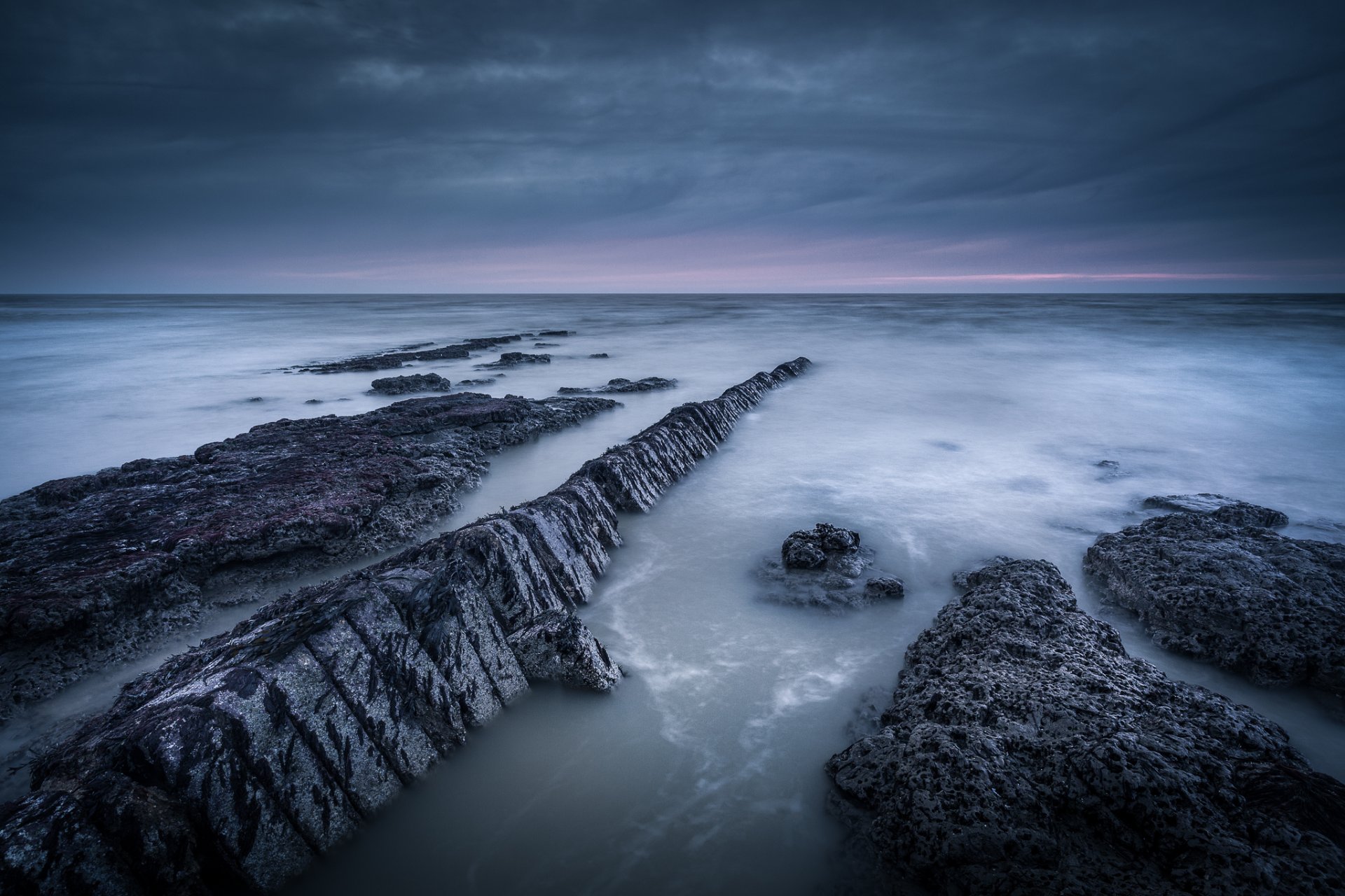 regno unito inghilterra suffolk mare del nord riva rocce sera cielo nuvole