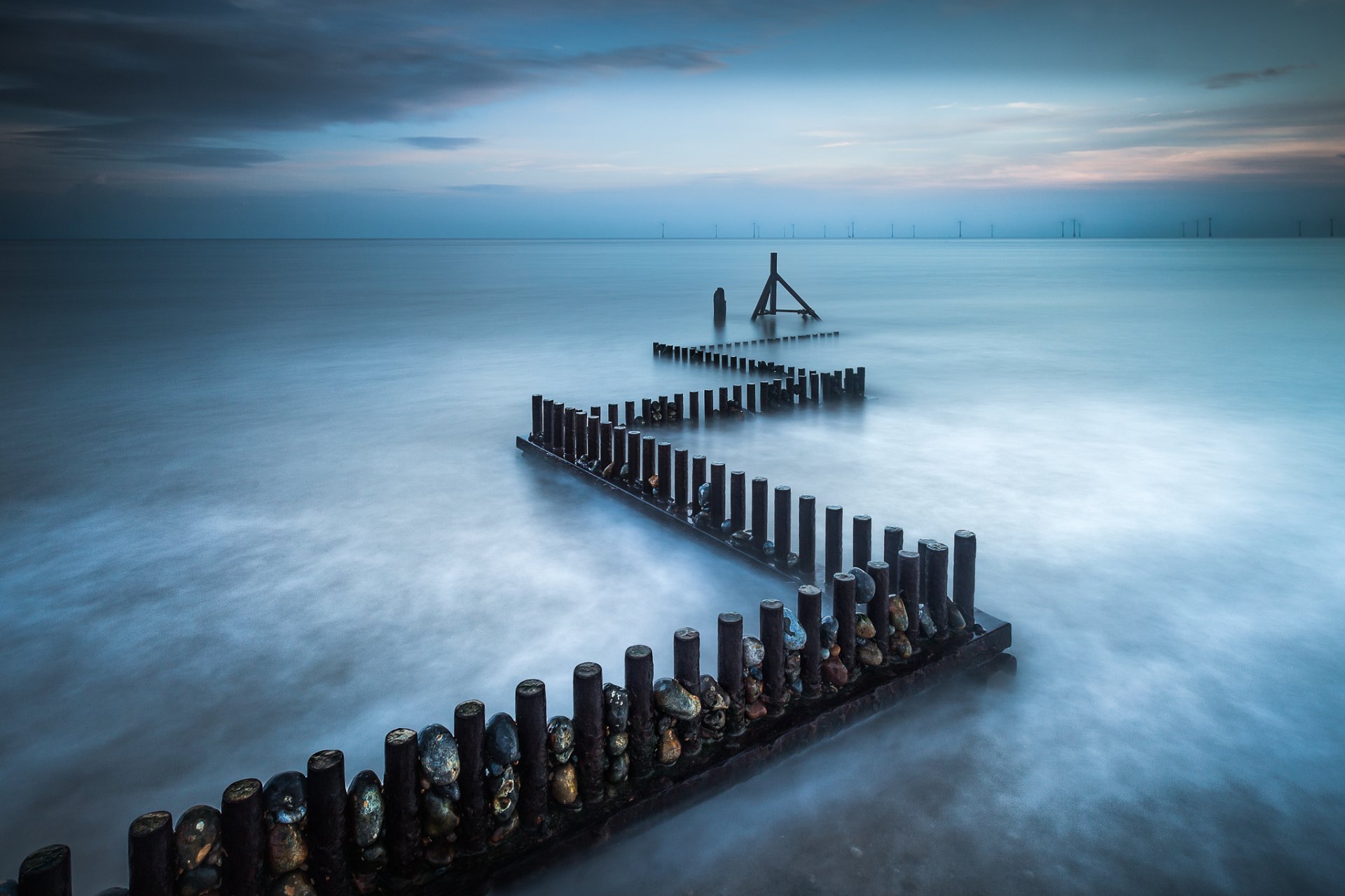 united kingdom england norfolk sea beach stones of the support sky cloud