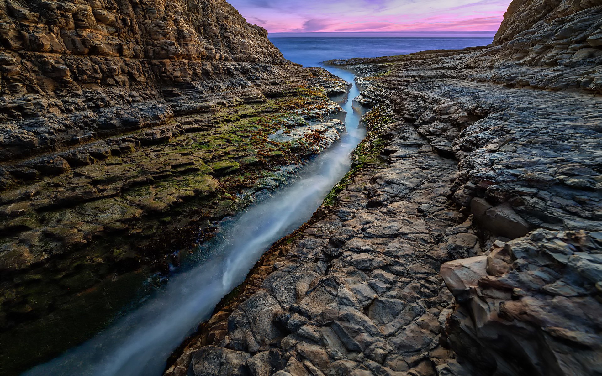 california océano rocas rocas grieta agua puesta de sol