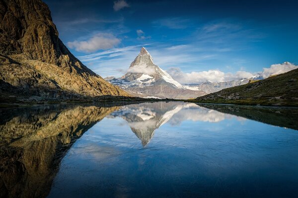 Reflection of a mountain in an alpine lake