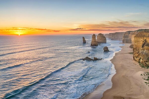 The blue sea embraces the sand