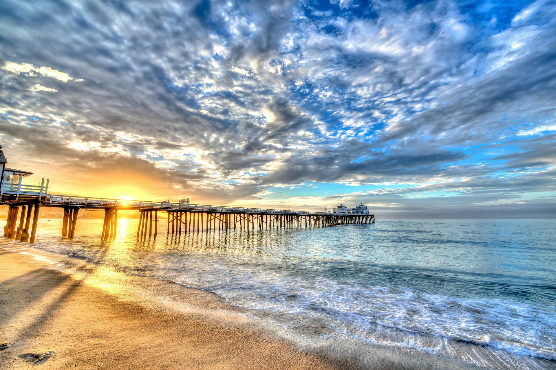 ky clouds rays sea pier sunset sun beach sand