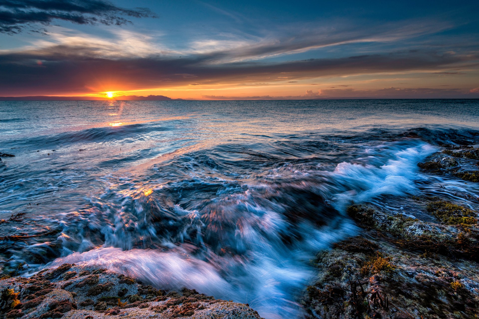 ocean stones beach dawn horizon sun