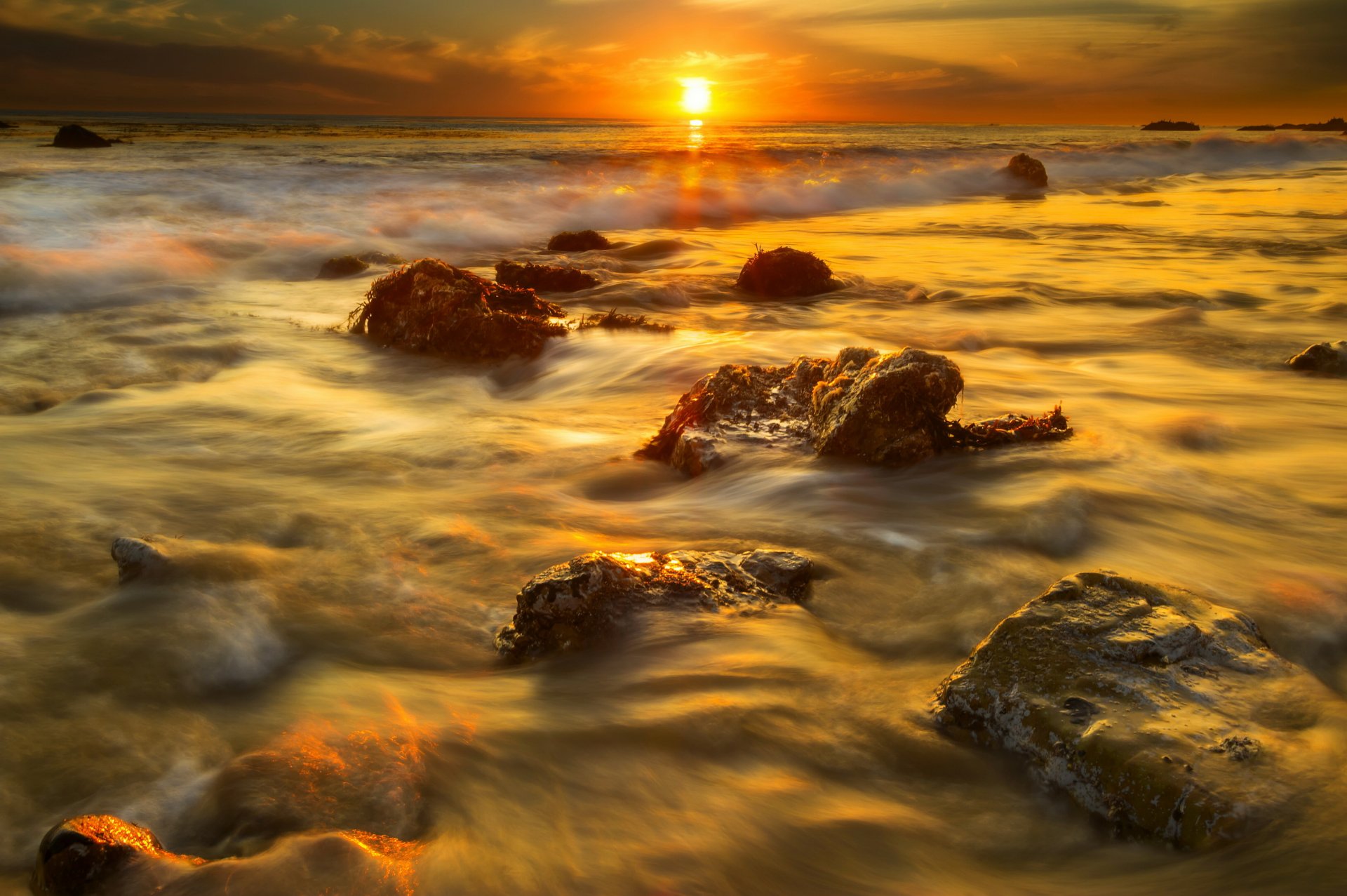 california malibu beach stones algae sun sunset