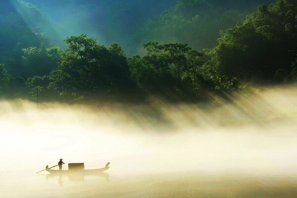 Floating boat in the fog