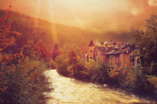 Autumn city on the river bank