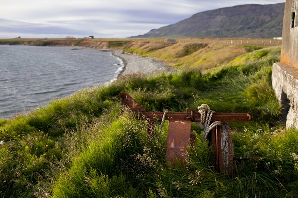 Iceland, on the seashore, a piece of iron tied with a rope