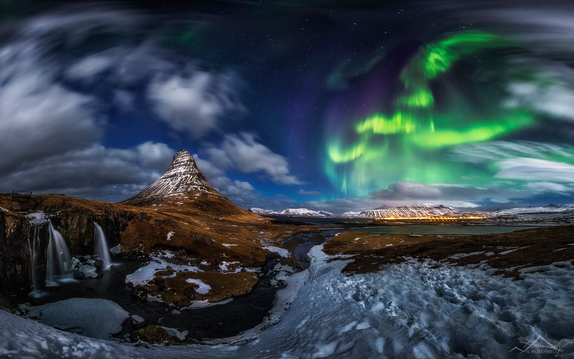 iceland kirkjufell mountain volcano rock waterfall snow night northern lights star clouds panorama