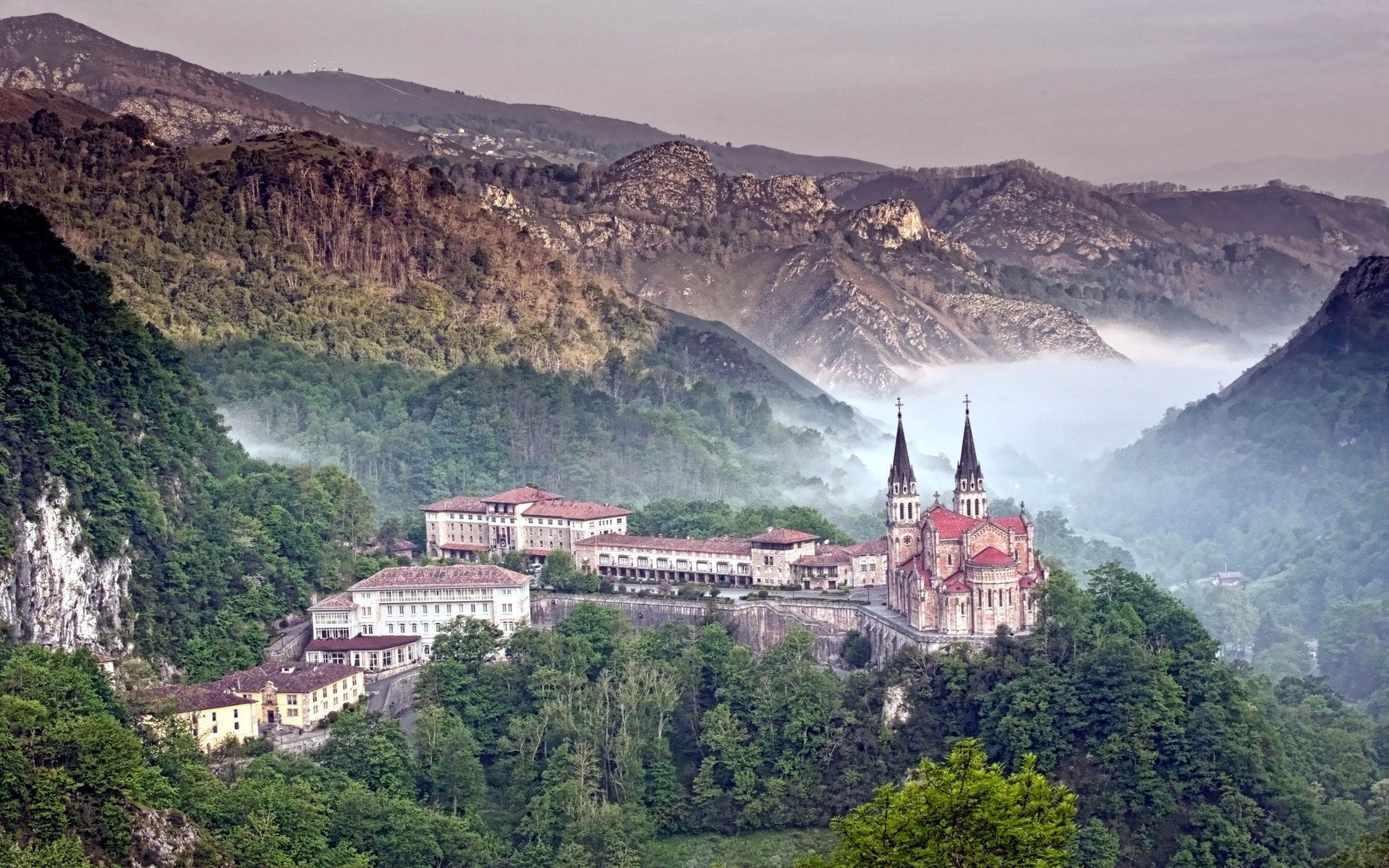 mountain forest fog buildings covadonga castle cathedral asturias spain range picos de europa nature photo