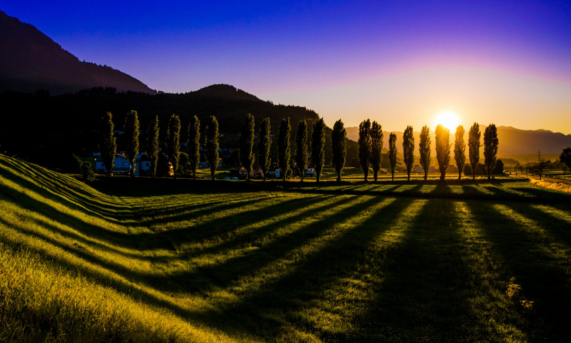 nenzing austria tramonto cielo sole alberi ombra prato erba paesaggio