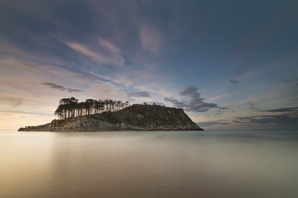 An island in a quiet and calm sea