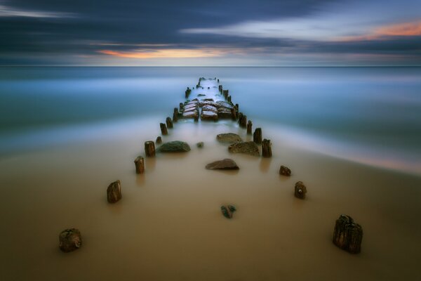 A path of stones leading into the sea