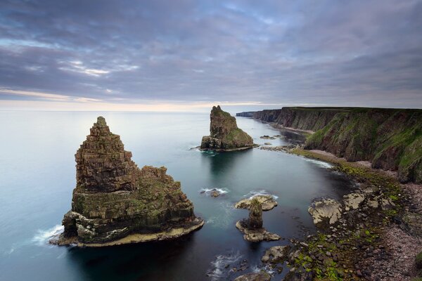 Rocks in the form of castles in a calm sea