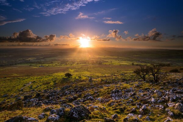 Sunset landscape against the background of the morning sunrise