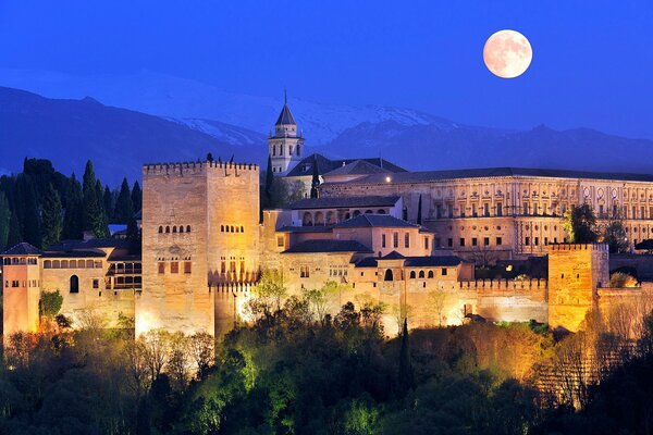 White moon over a large fortress