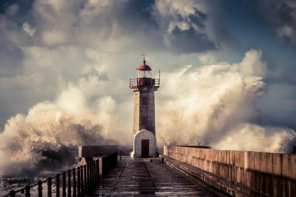 Image of a lighthouse on the background of a storm