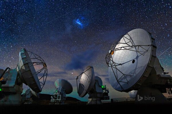 Radio telescope in the Atacama desert under the starry sky