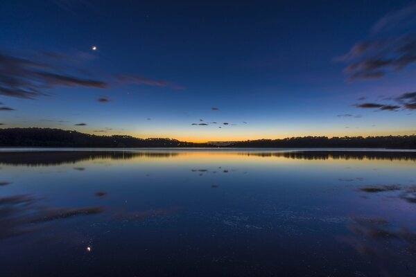 Landscape with lake and sky at dusk