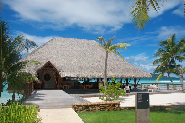 Bungalow on the shore of the blue ocean