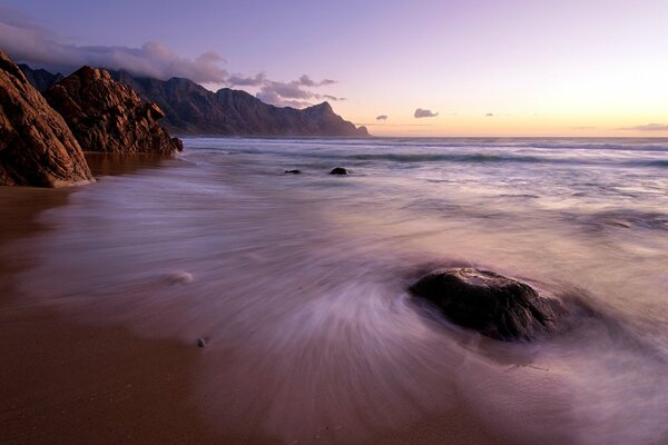 Evening sunset on the sea in purple shades