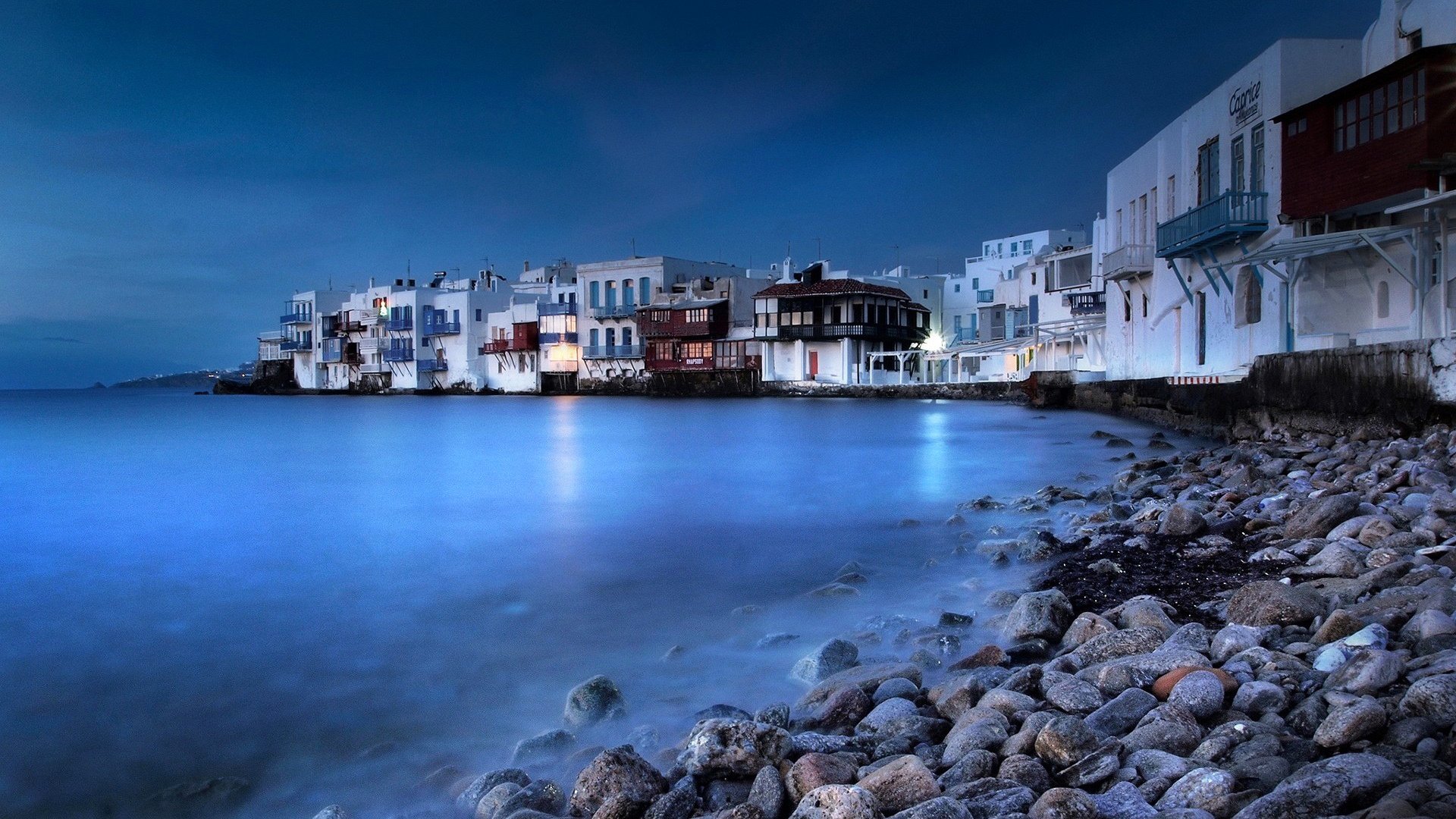 mykonos grecia isola notte cielo mare città casa