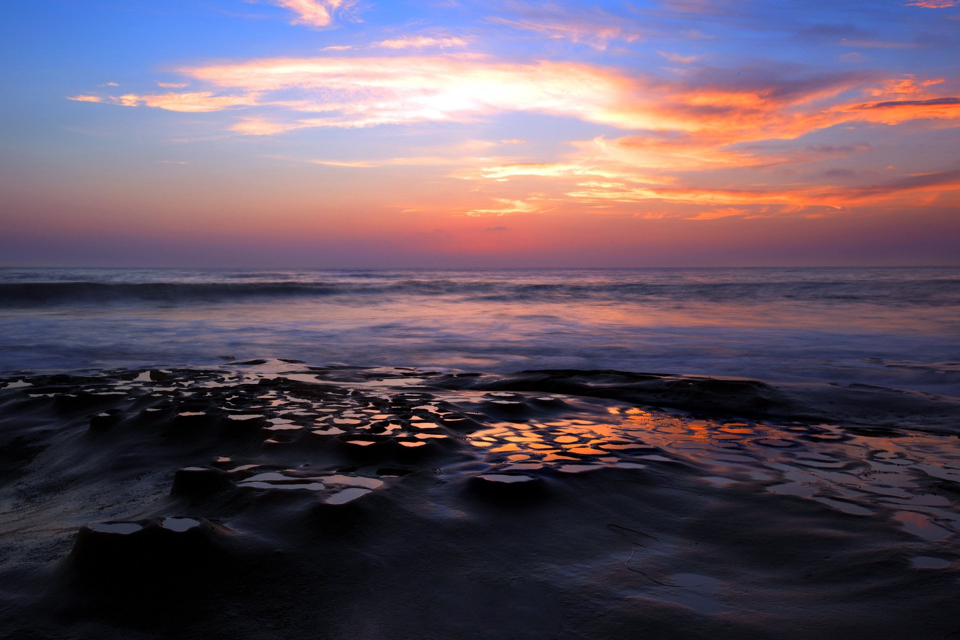 unset sea rock landscape