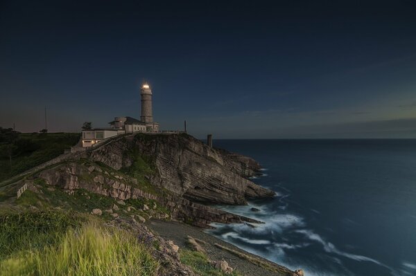 Lighthouse away by the ocean