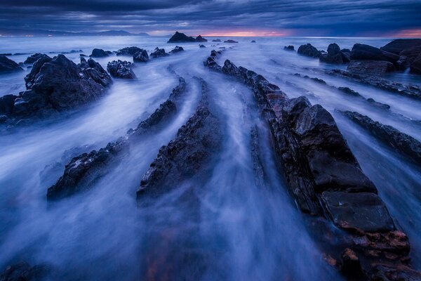 Misty rocks at sunset