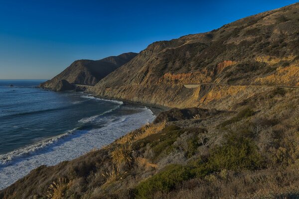 Morning beach on the sea mountains