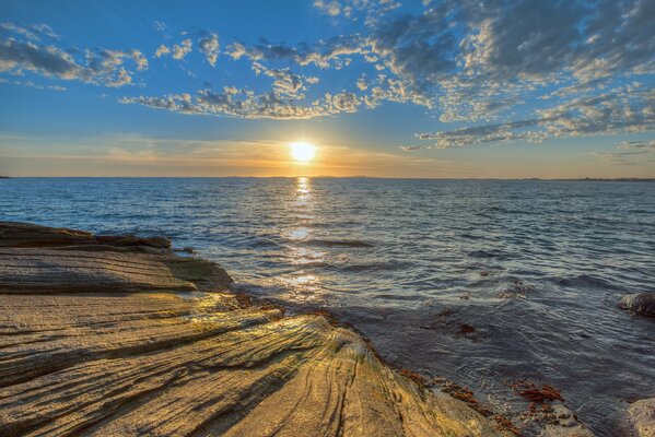 Warm sunset on a rocky shore