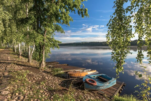 Boats on the bank of a wide river