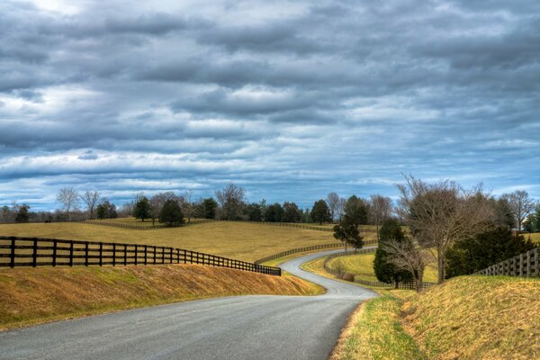 A long road on the background of a beautiful landscape