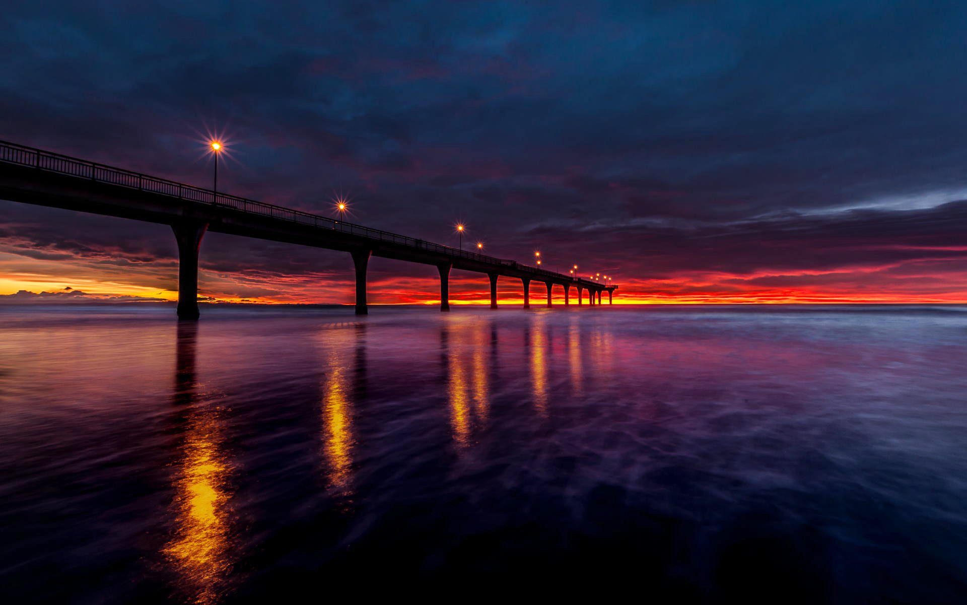 nouvelle-zélande baie eau jetée lanternes lever du soleil ciel couleur