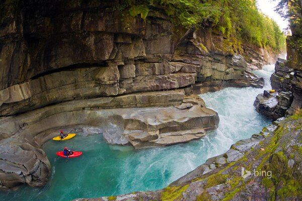 2 boats floating on the river in the canyon