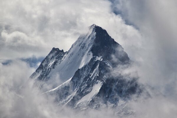 Alpine mountains in the clouds