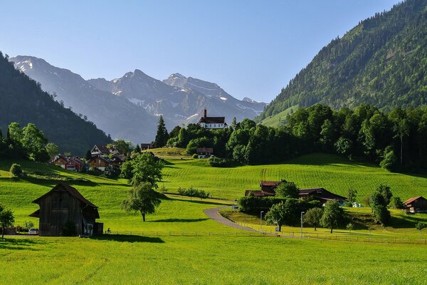 The house stands in a mountain valley