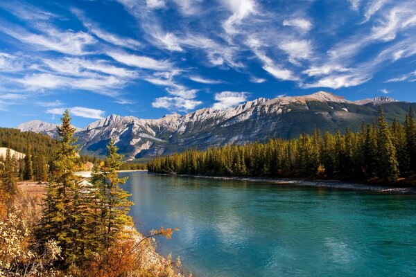 Autumn landscape. Forest, lake, mountains