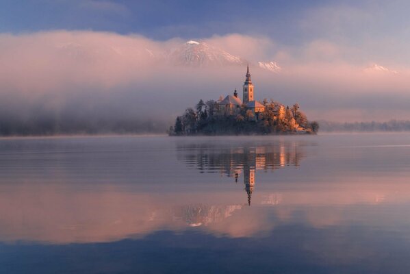 Morning fog. Island. Slovenia
