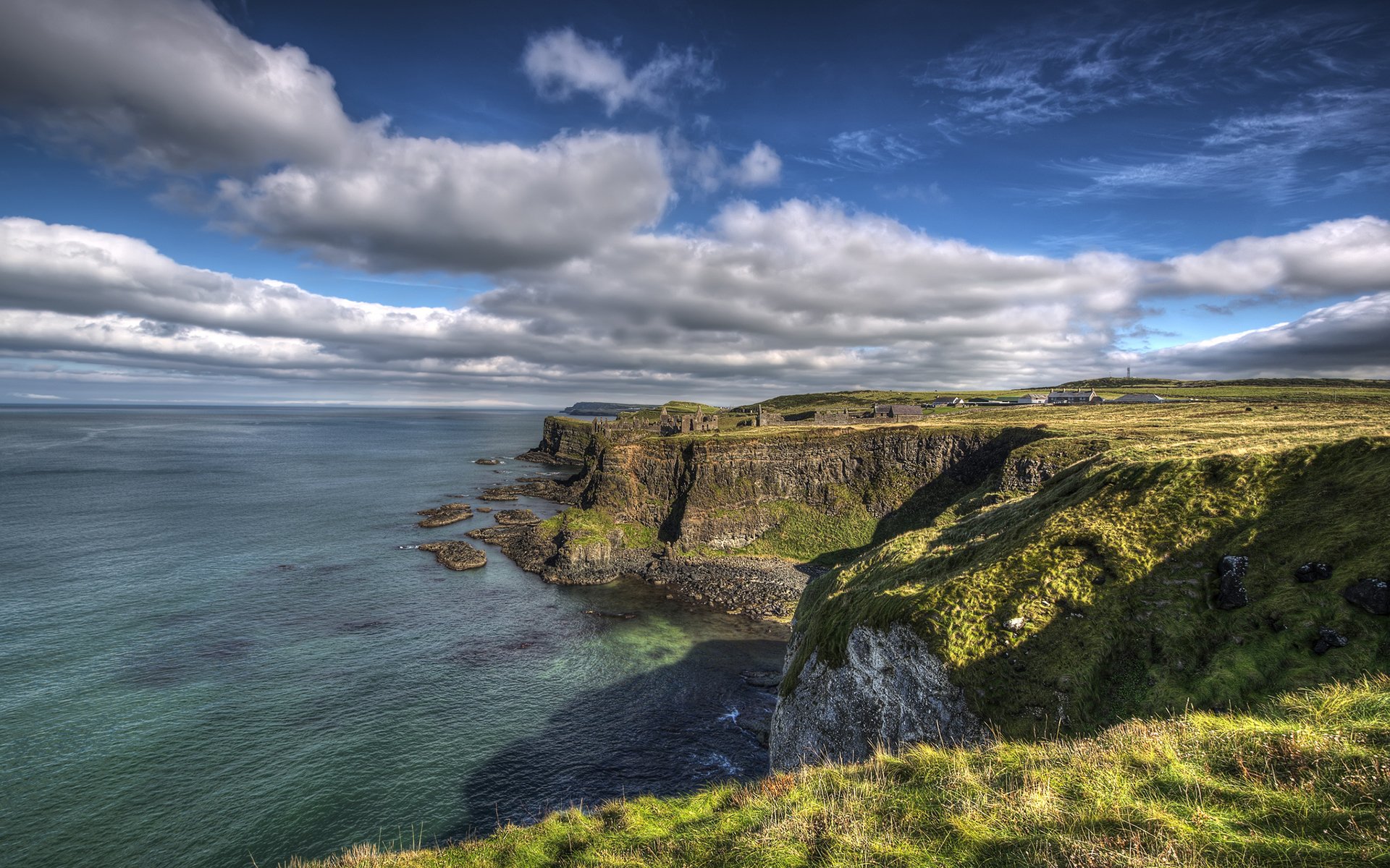 portrush ireland coast rock atlantic ocean sky