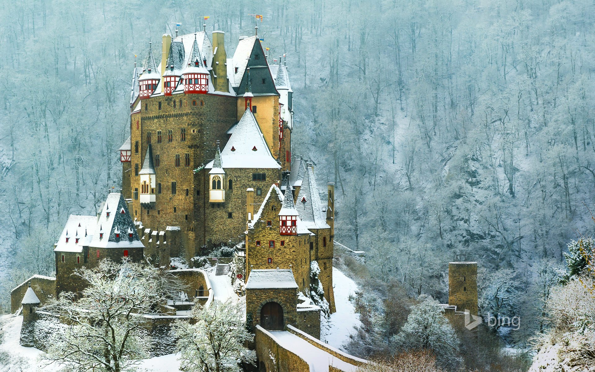 eltz castle verses germany mountain slope forest snow