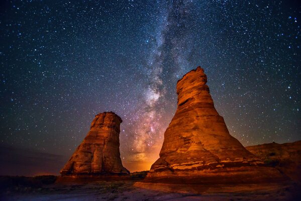 The night starry sky. Two towers and the Milky Way