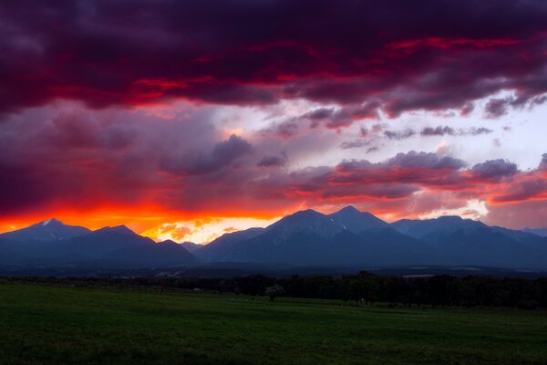 Time of witches in the USA Colorado: evening, fiery sunset, sky in clouds and clouds