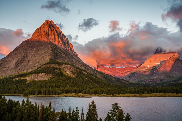 Dawn in the mountains, where there is both a forest and a lake